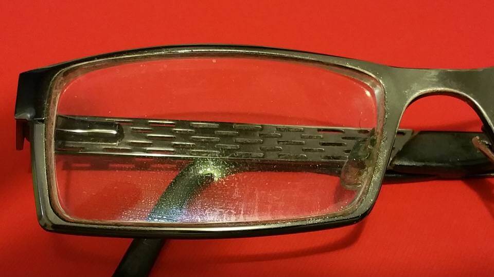 Eyeglasses Before Window Cloth